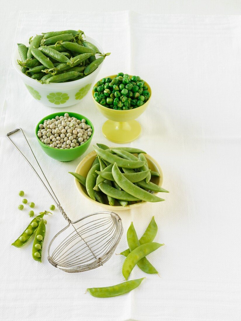 An arrangement of peas (fresh, dried, pods)