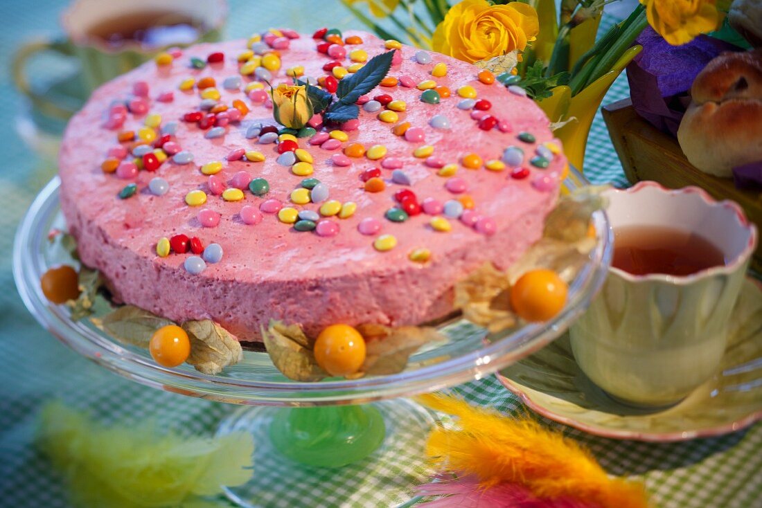 Raspberry mousse tart with coloured Smarties for Easter