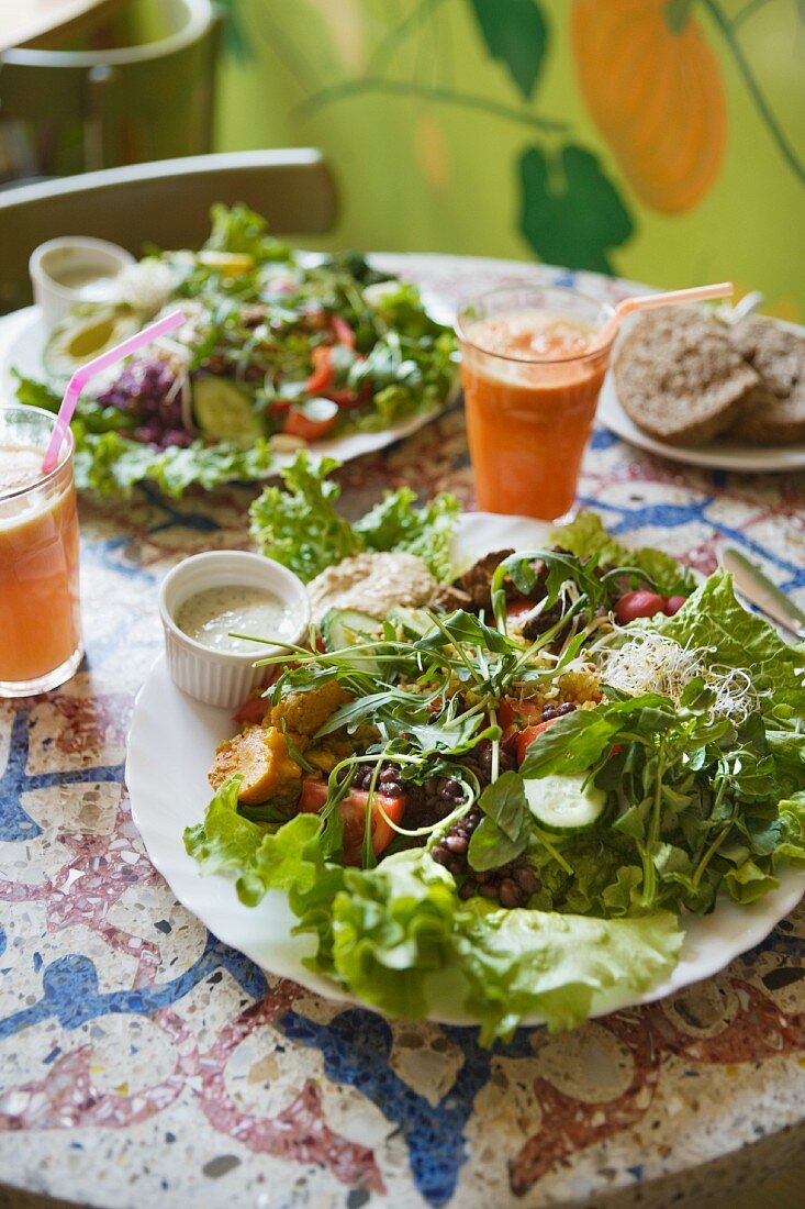 Large plates of salad with dressing