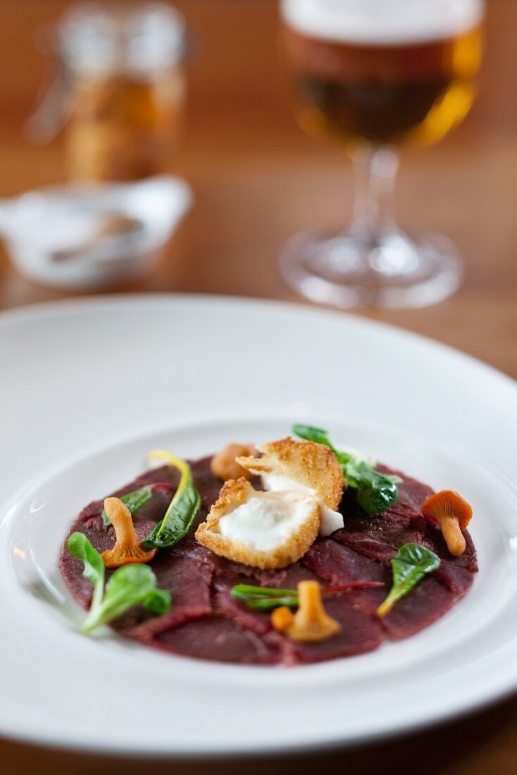 Reindeer fillet with baked camembert and chanterelles