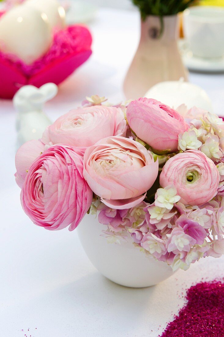 Posy of ranunculus on festive Easter table