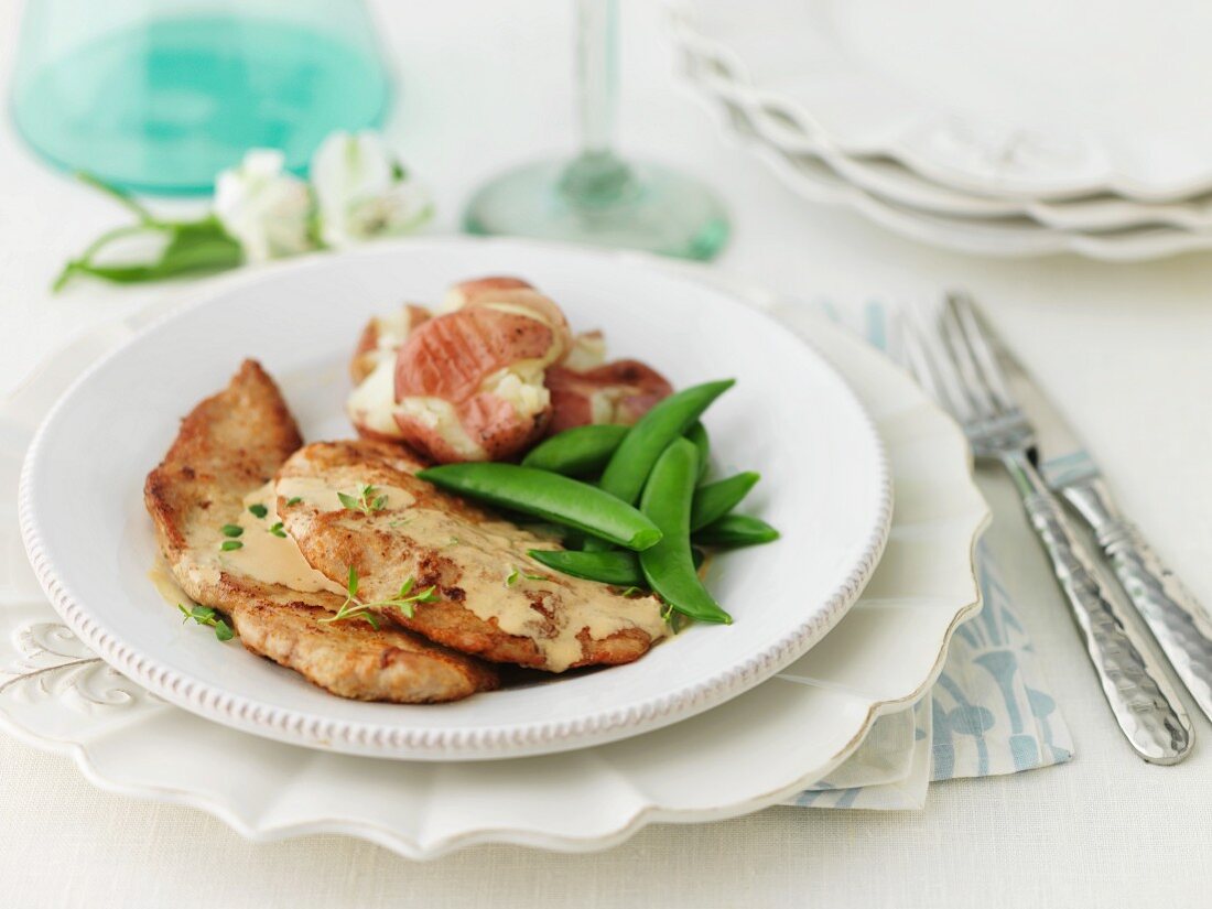 Veal escalope with mange tout
