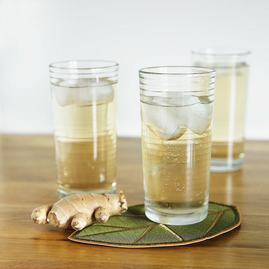 Glasses of Homemade Ginger Ale with Fresh Ginger Root