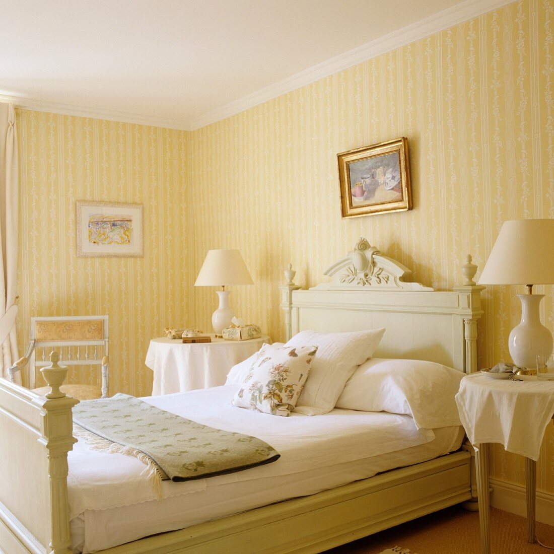 Light, traditional bedroom with yellow and white striped wallpaper