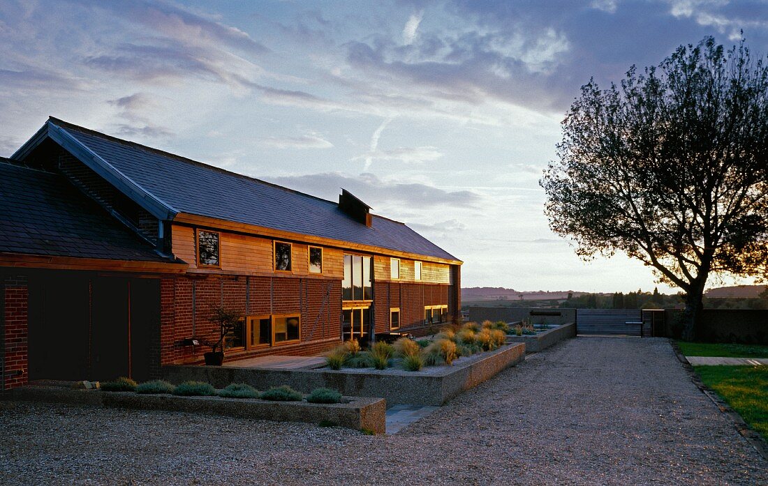 View of long house at dusk