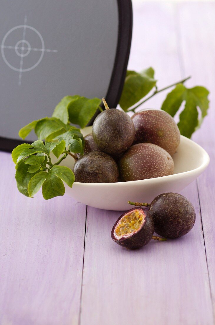 A bowl of passion fruits