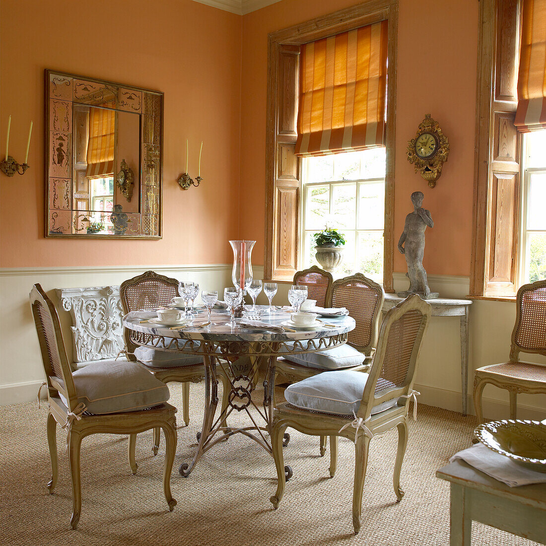 Dining area with antique round table and chairs