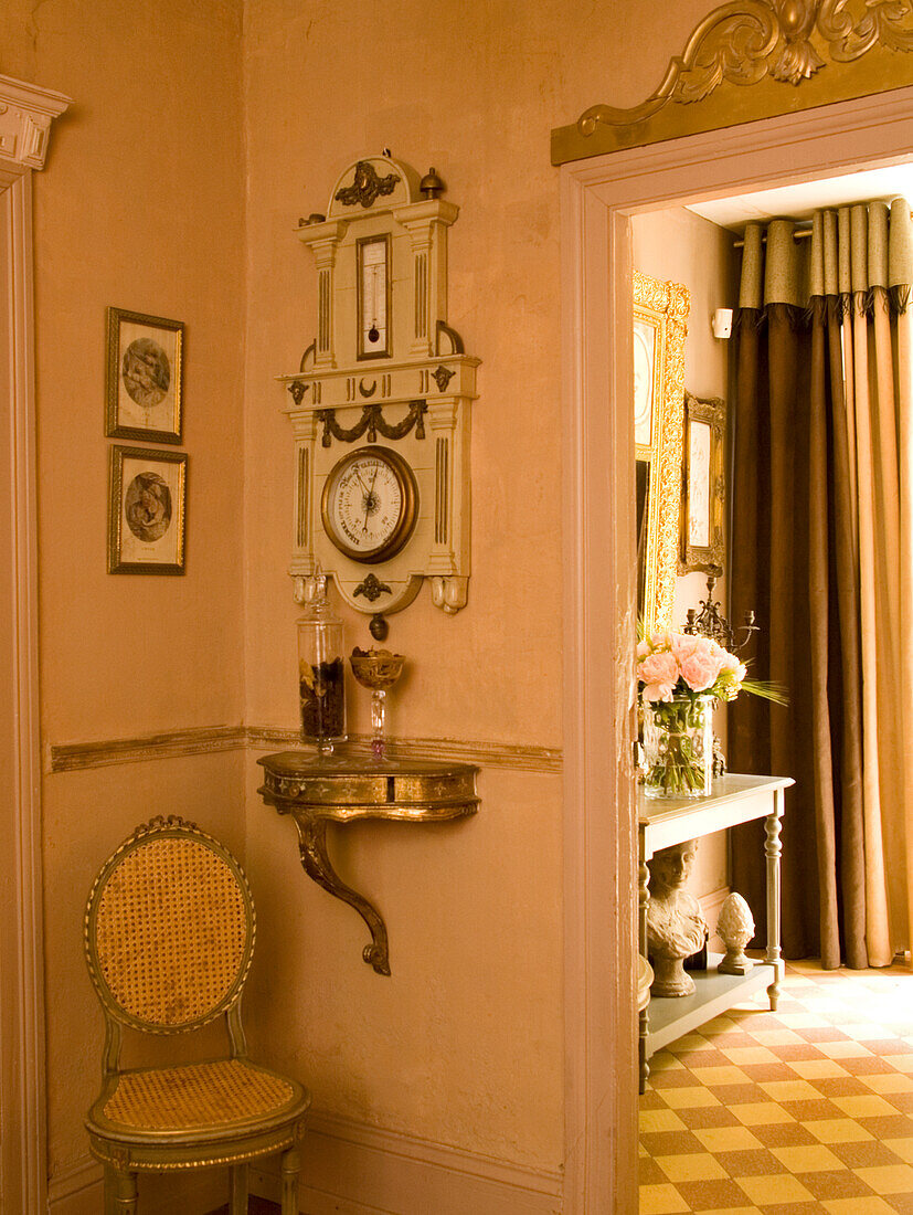 Antique barometer and door decoration in the hallway of a historic house