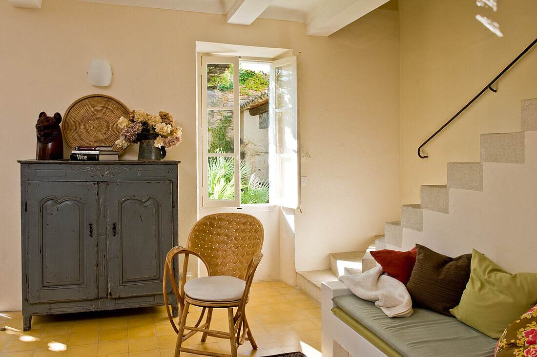 Country-style room with yellow tiles and open window