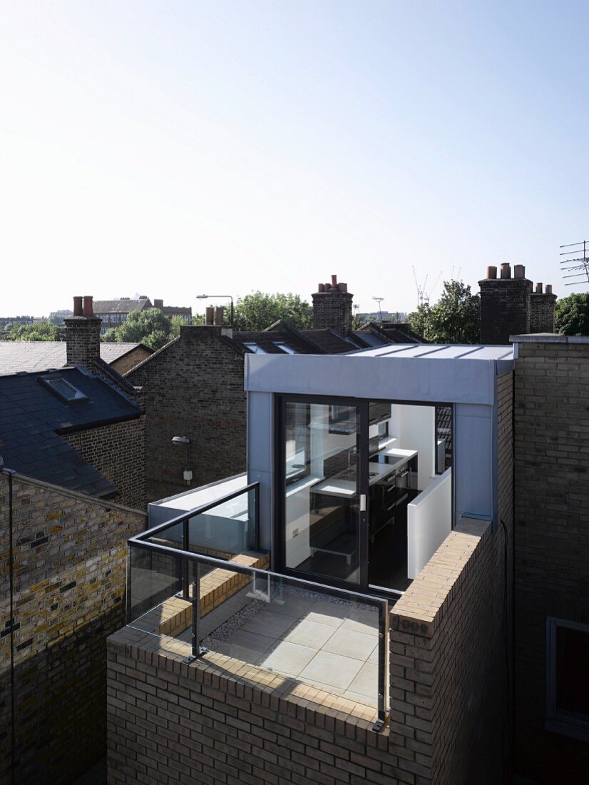 Modern house with kitchen and terrace on top storey