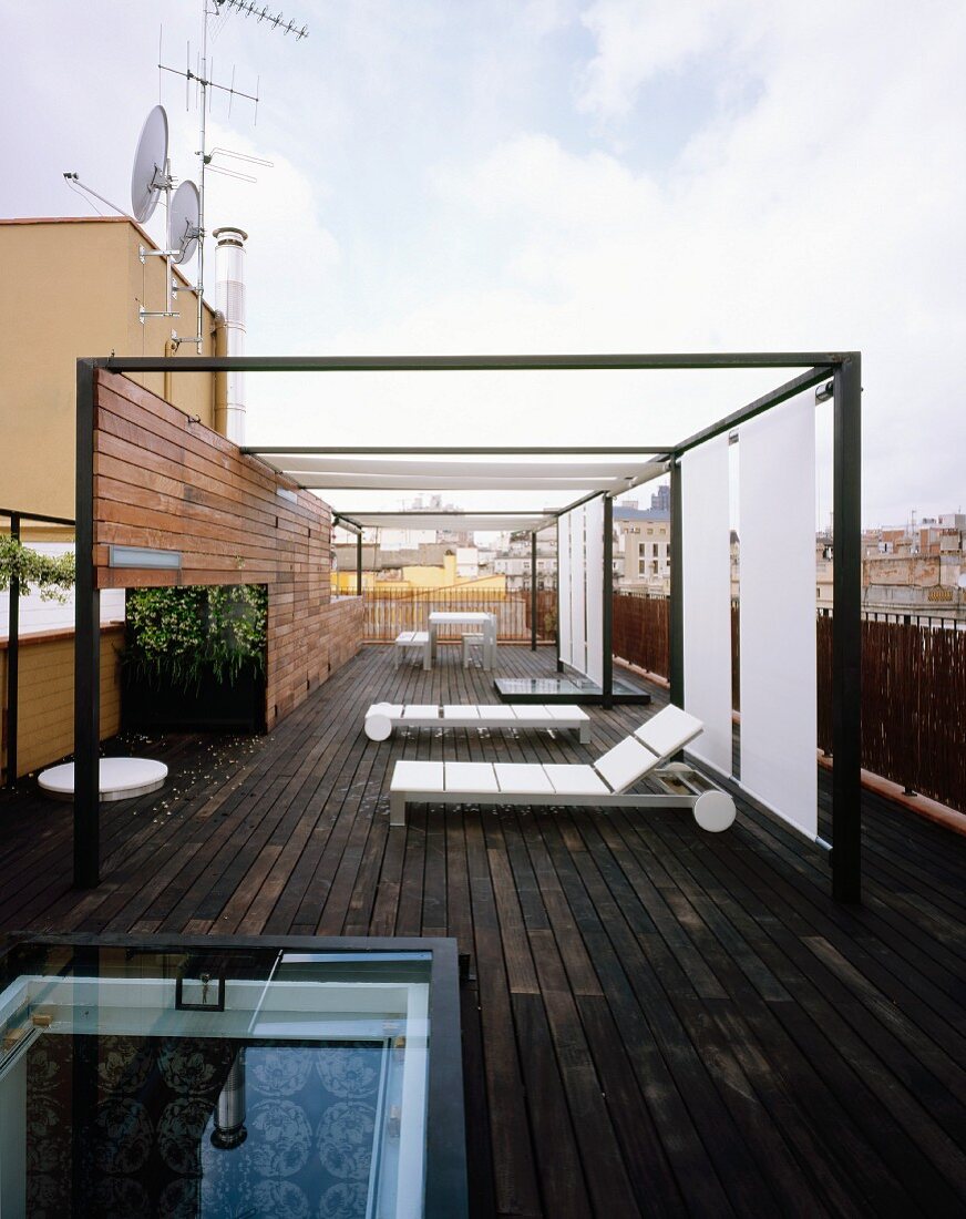 Modern terrace with terrace furniture, sunshades and entrance through sliding, glass roof hatch