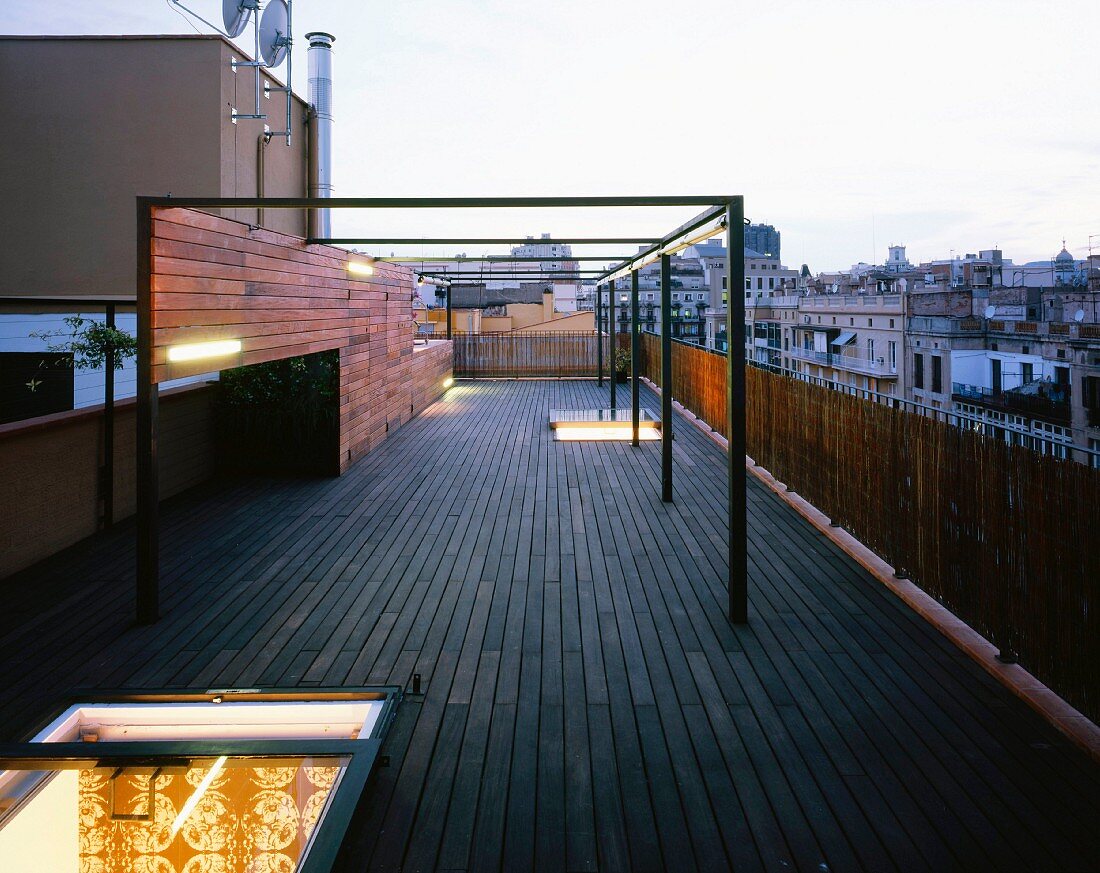 Terrace at dusk with illuminated roof hatch