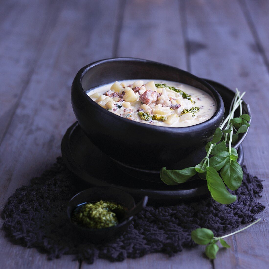 Wintry potato soup with pesto and diced bacon