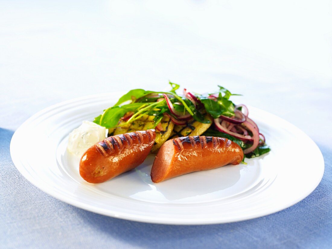 Grilled sausage with a side salad