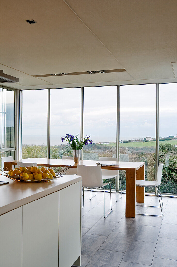 Kitchen with dining table and view of the greenery