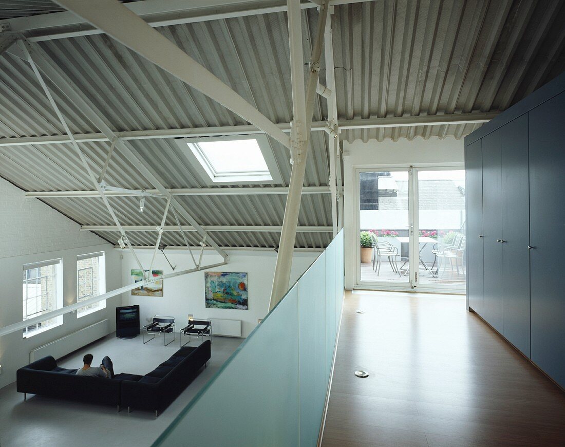 View of living room from mezzanine in loft apartment