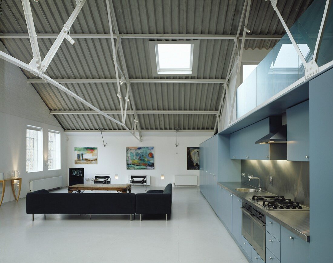 Open-plan kitchen and living room in loft apartment