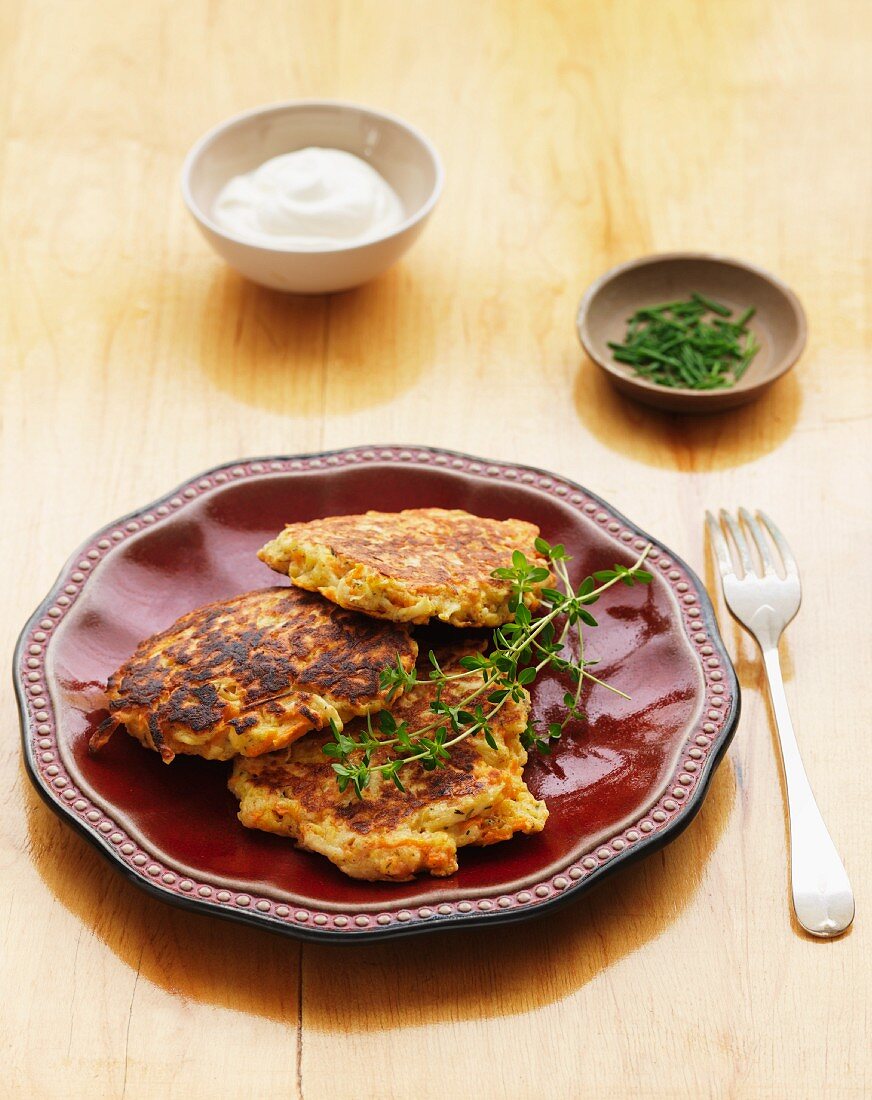 Latkas with herbs and sour cream