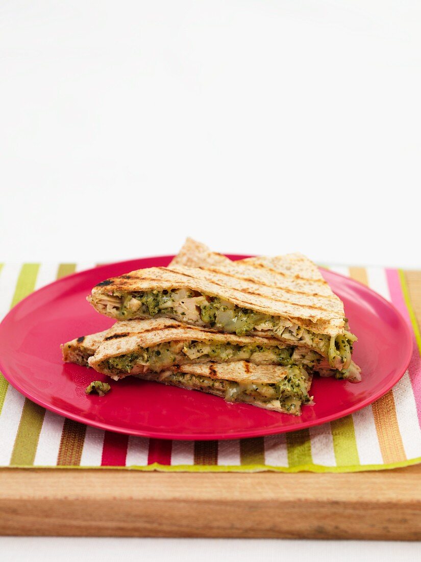 Quesadillas on a red plate