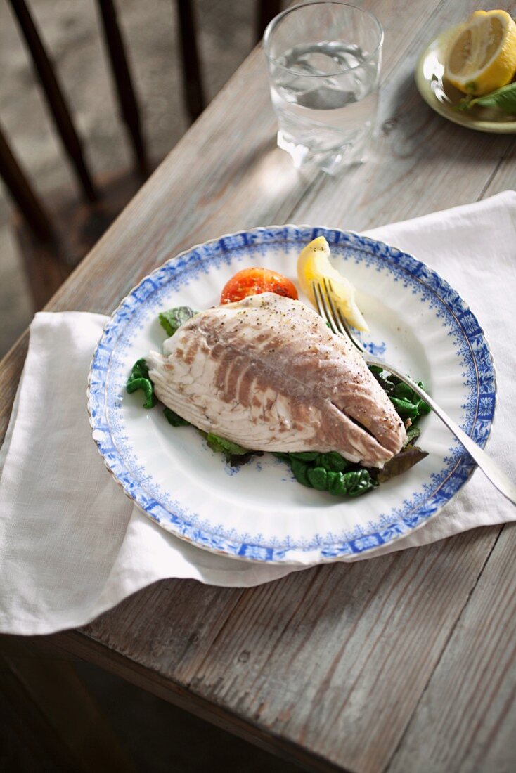 Poached fish fillet on a bed of chard
