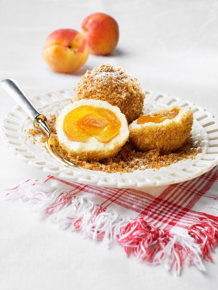 Apricot dumplings with icing sugar