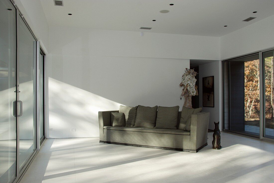 Living room with sofa & large windows