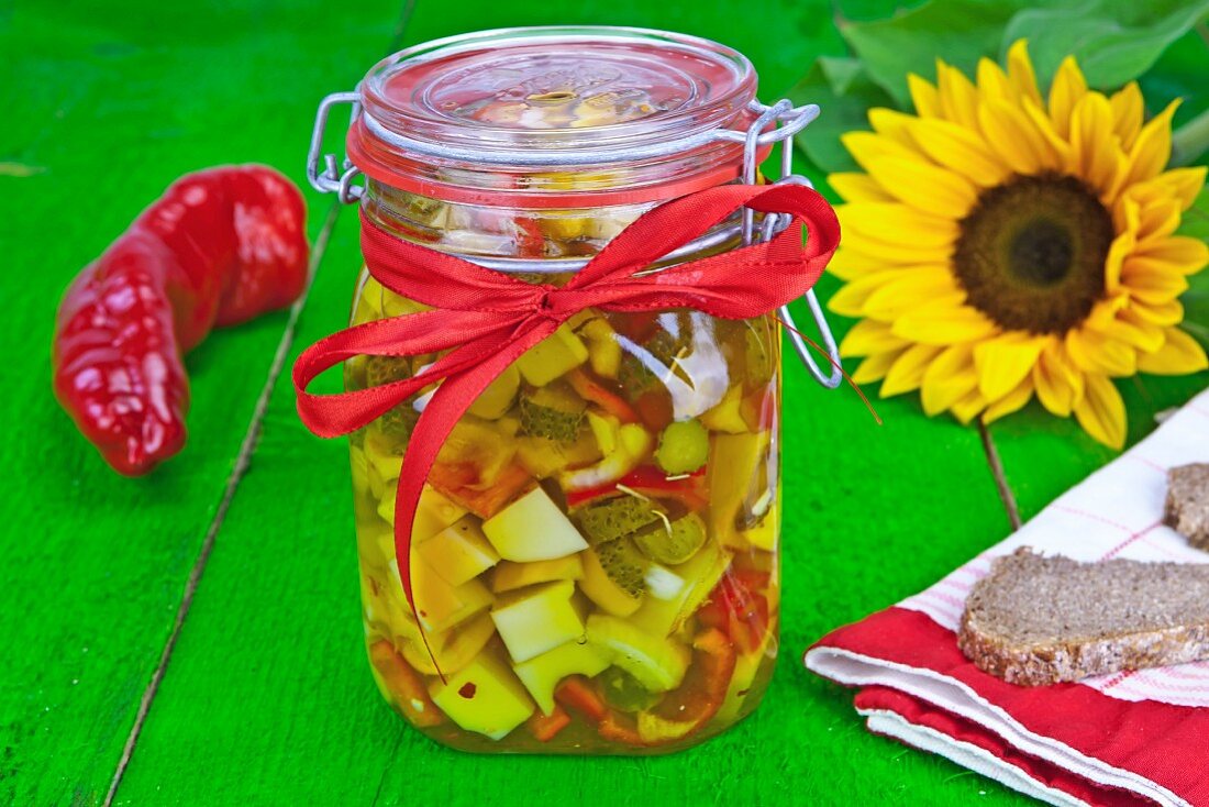 Swiss cheese pickled with vegetables and spiced olive oil