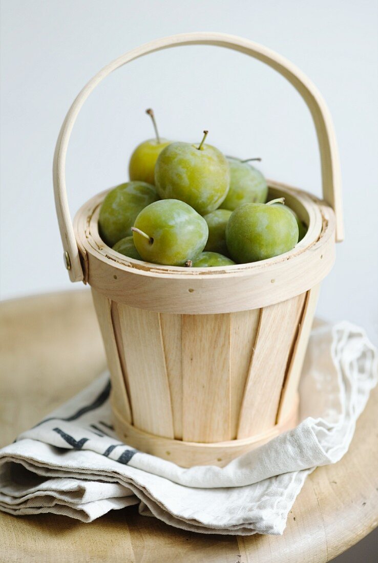 Greengages in a basket