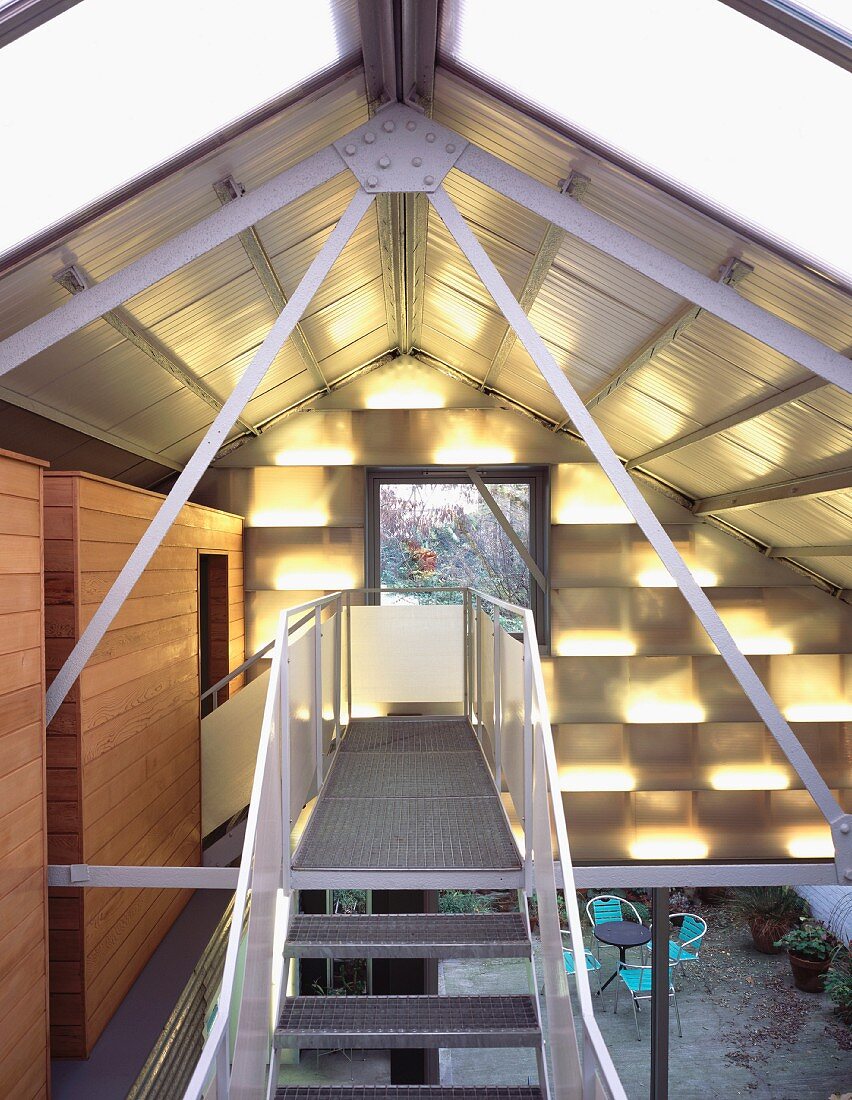 Metal steps beneath roof in contemporary house