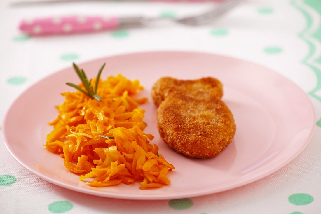 Fish-shaped fish patty with grated carrots