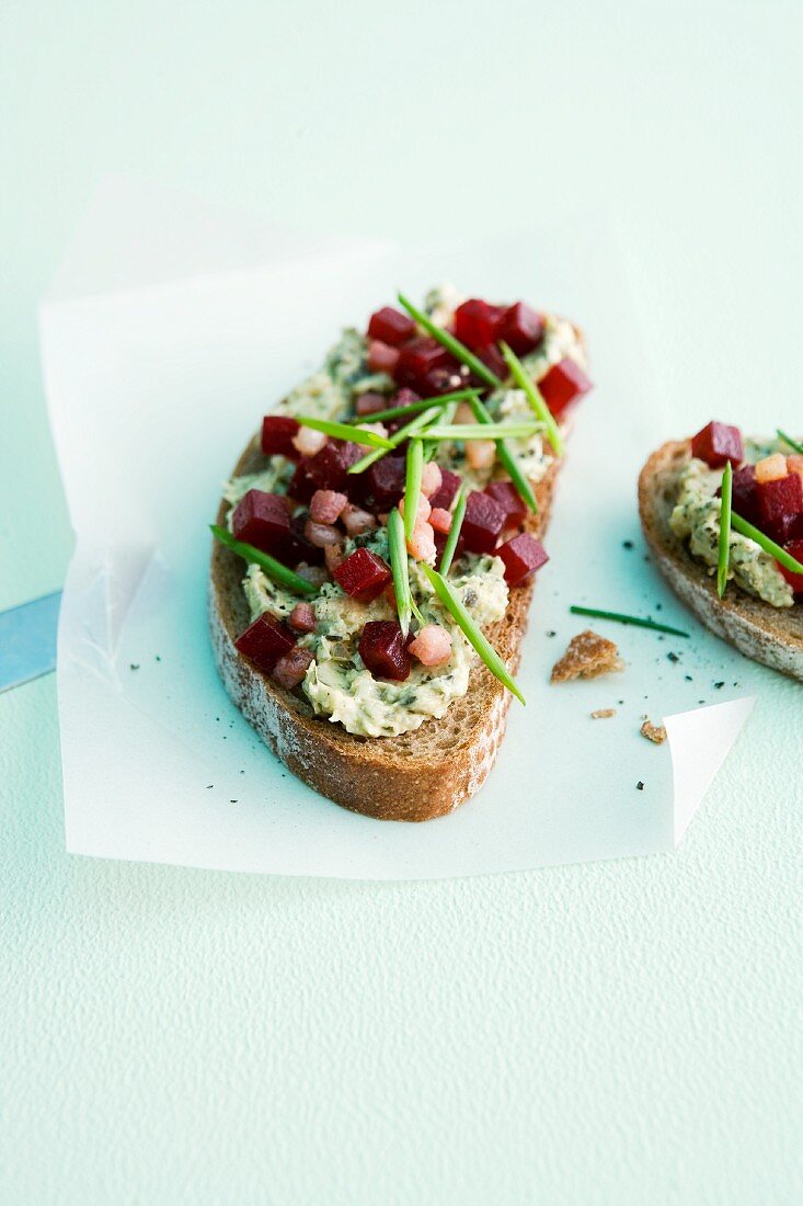 Bread topped with pumpkin seed butter and diced beetroot