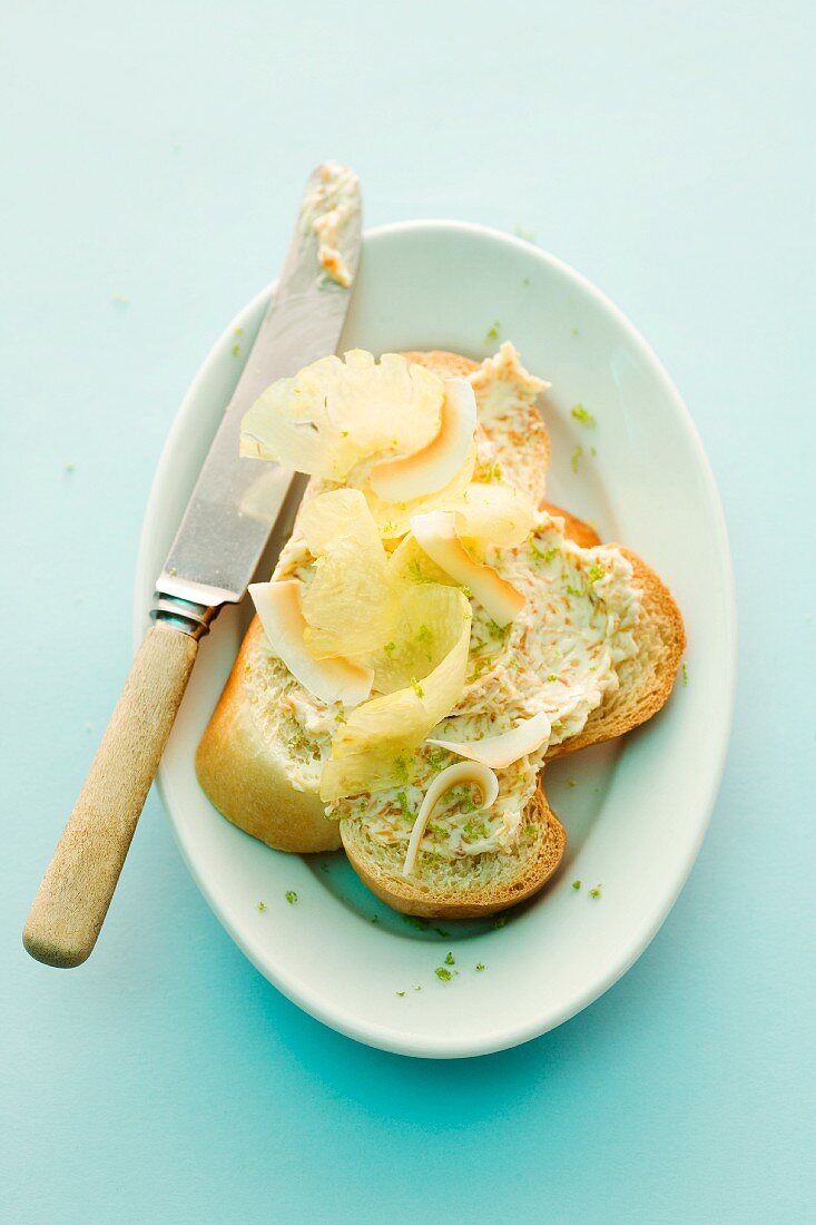 Slices of bread topped with coconut and rum butter