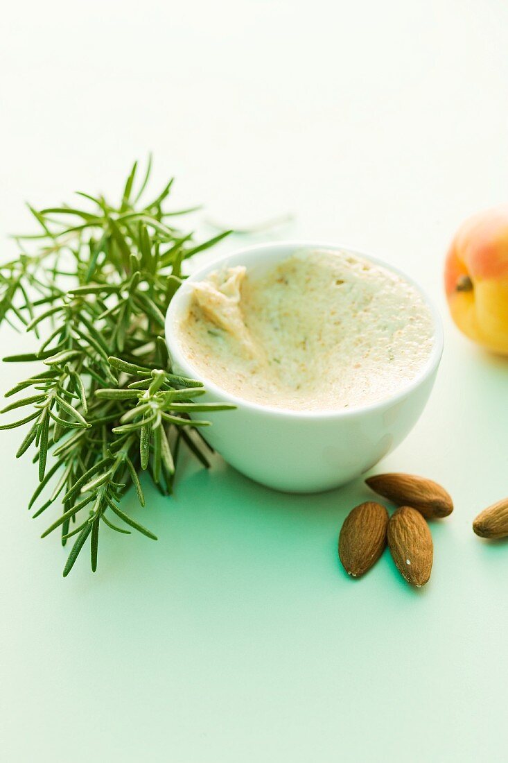 A bowl of almond butter with rosemary