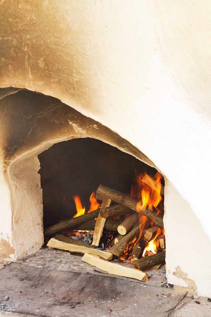 Burning firewood in hearth