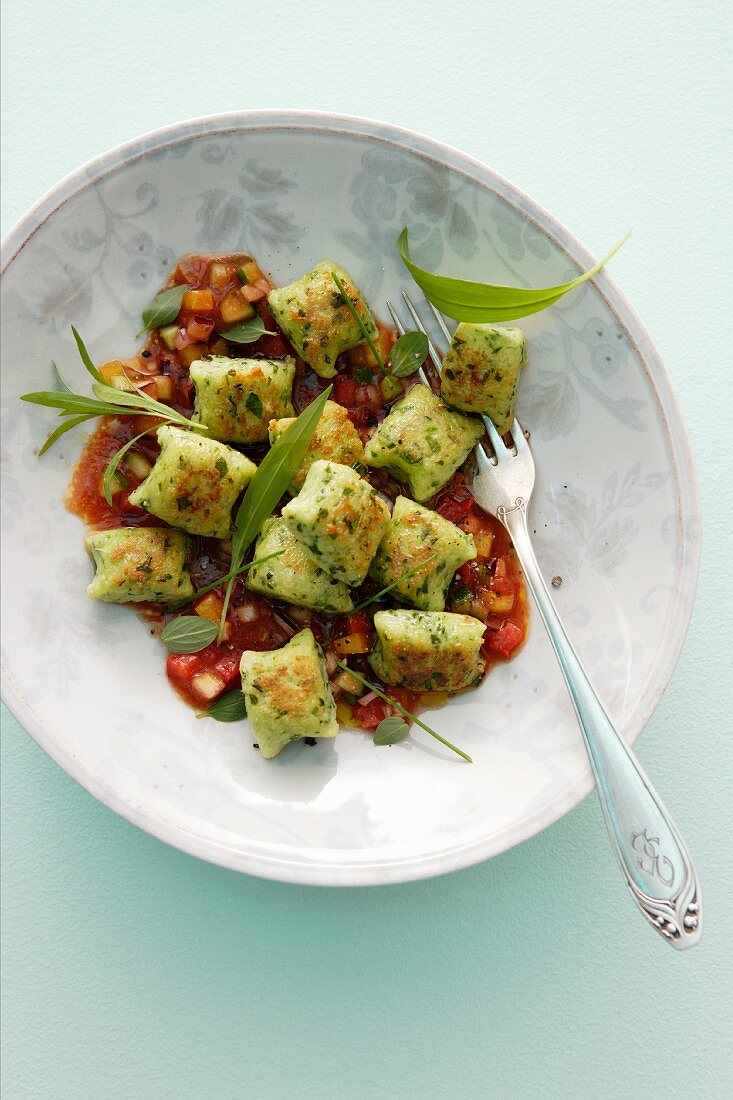 Herb gnocchi with vegetable sauce