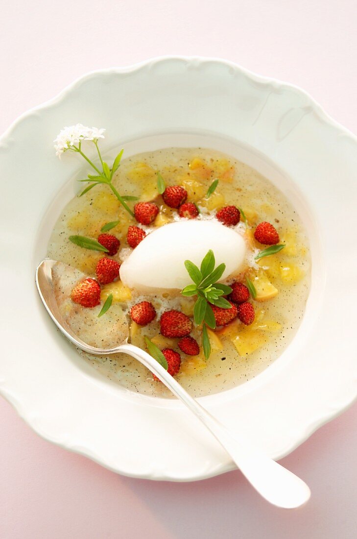 Peach-champagne soup with wild strawberries