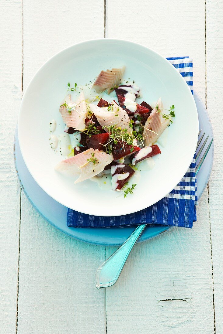 Red beet salad with salmon fillet