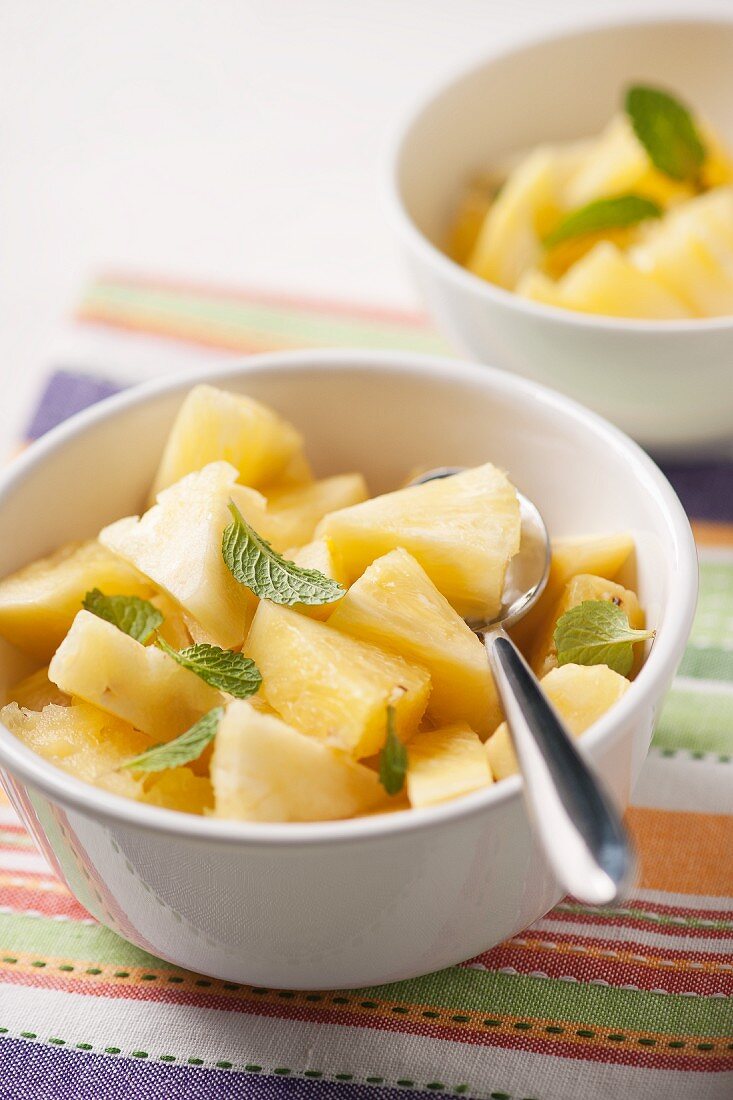Fresh pineapple with mint leaves