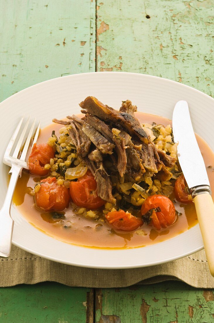 Lamb with pearl barley and tomatoes