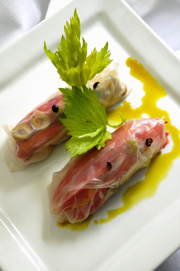 Rice paper rolls with celery and tomato and pepper confit