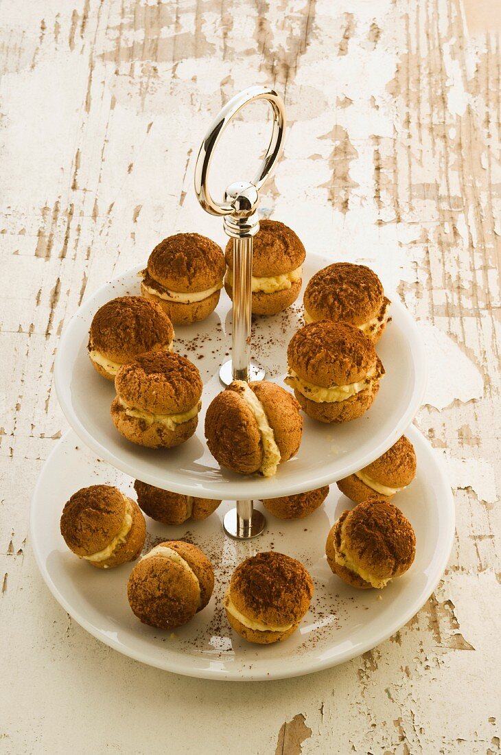 Amaretti filled with cream on a cake stand