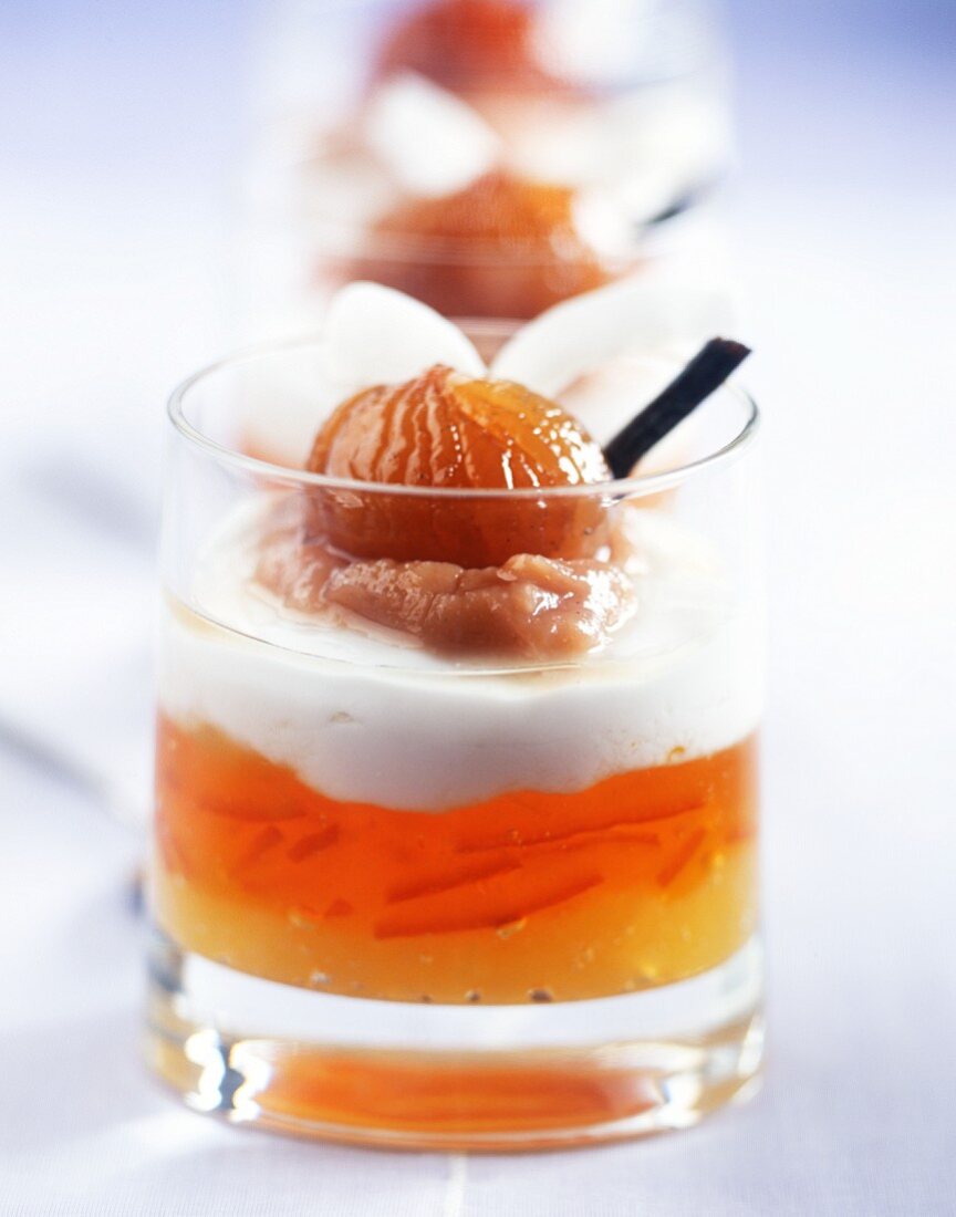 Layered dessert of orange and pineapple sauce, coconut cream and chestnuts