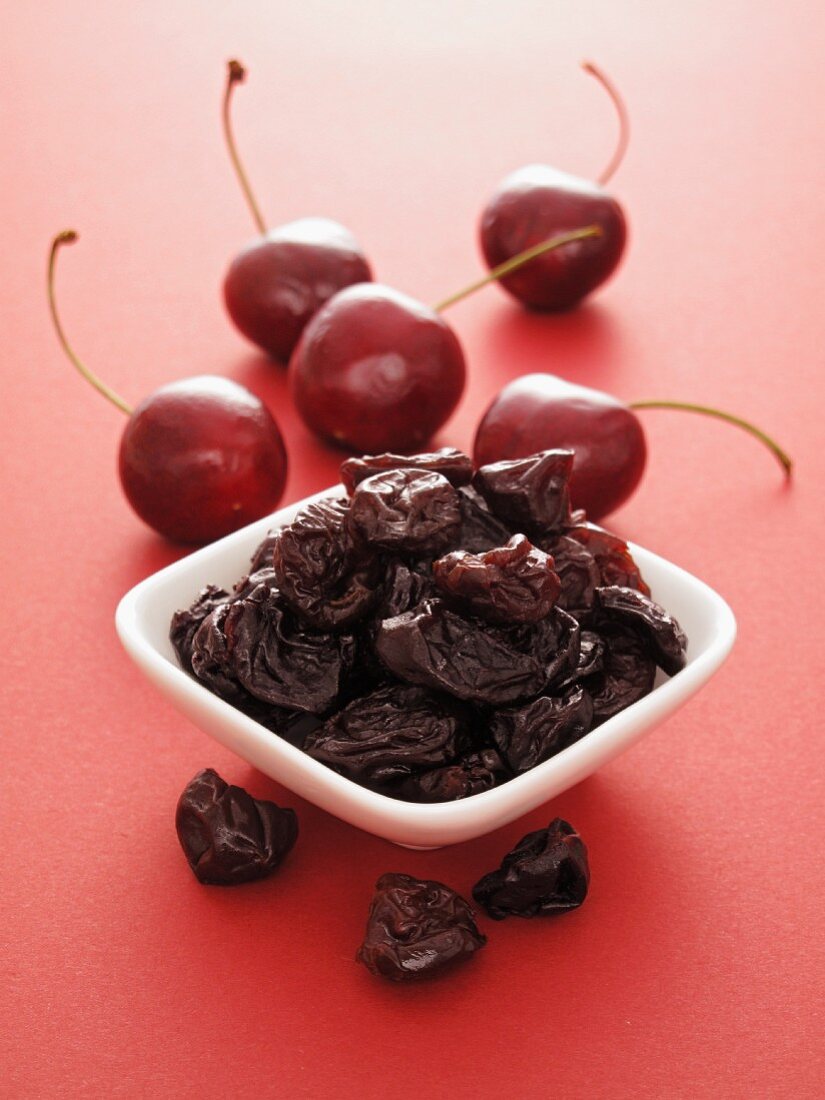 Fresh cherries and dried cherries in a bowl