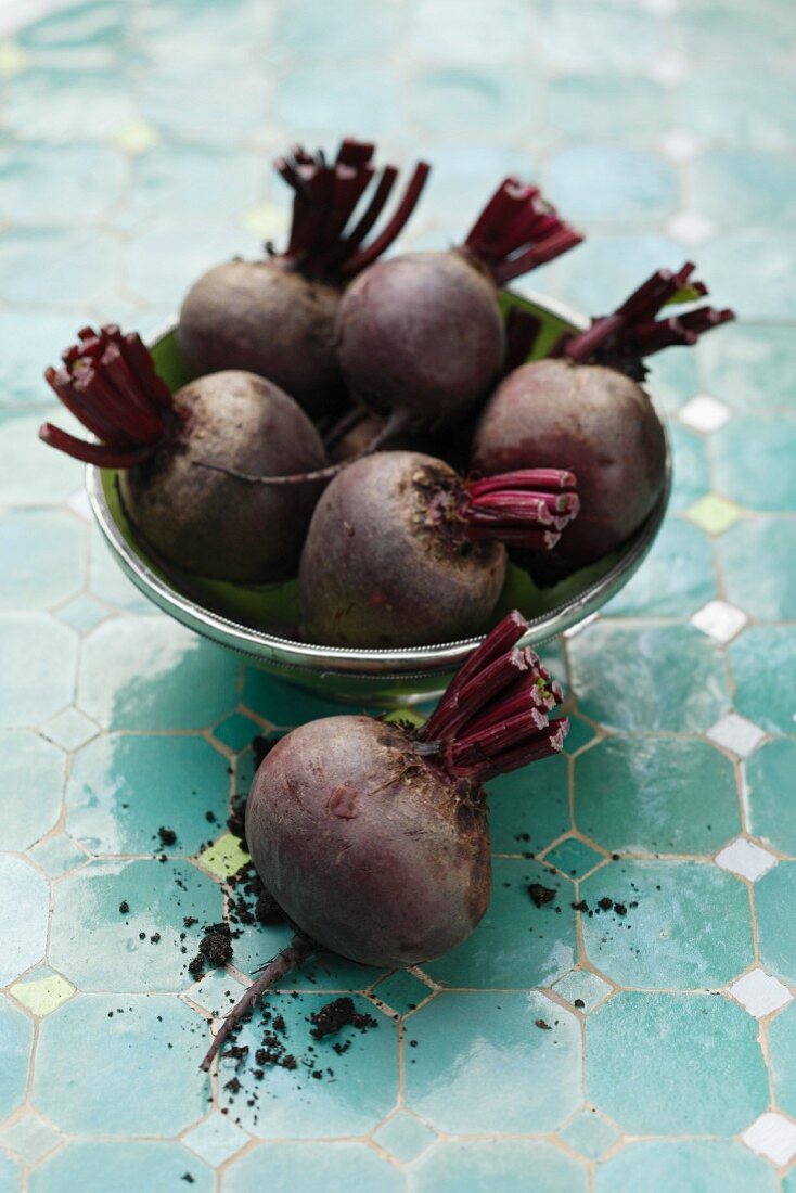 A bowl of beetroots and a one next to it