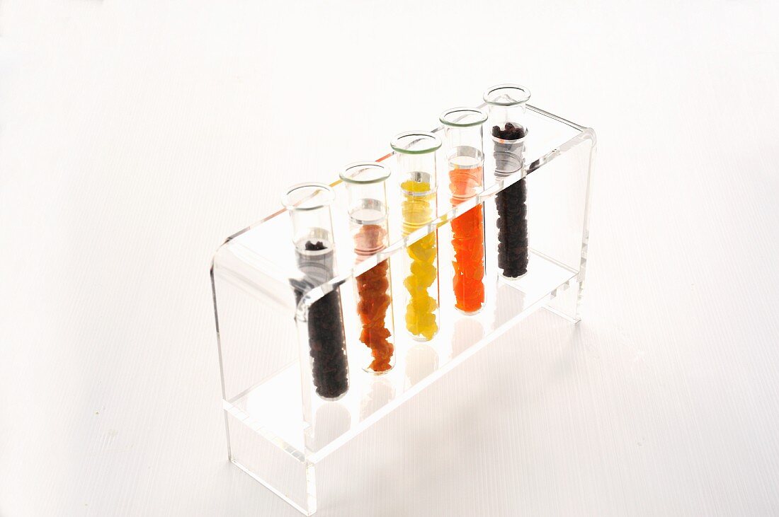 Various dried fruits in test tubes