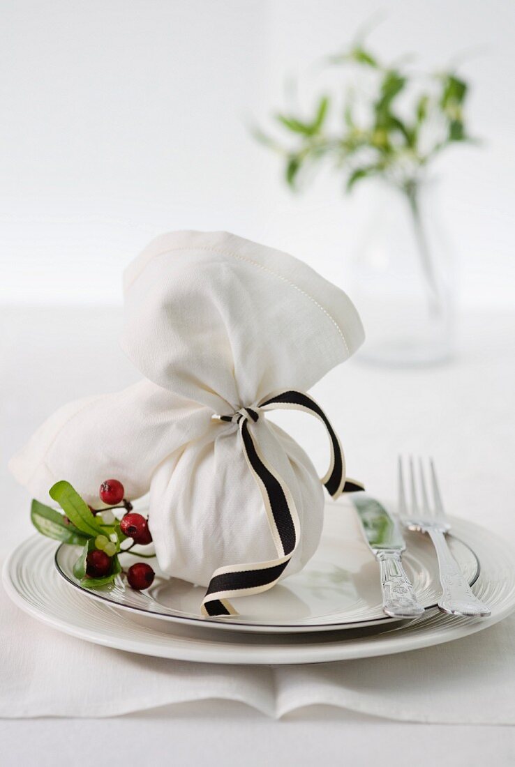 Christmas pudding wrapped in napkin as a party favour