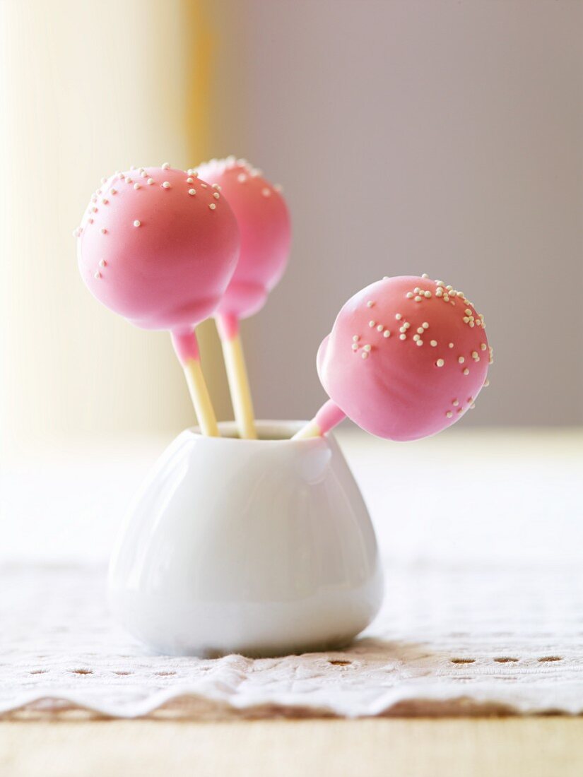 Three Pink Cake Pops with White Sprinkles