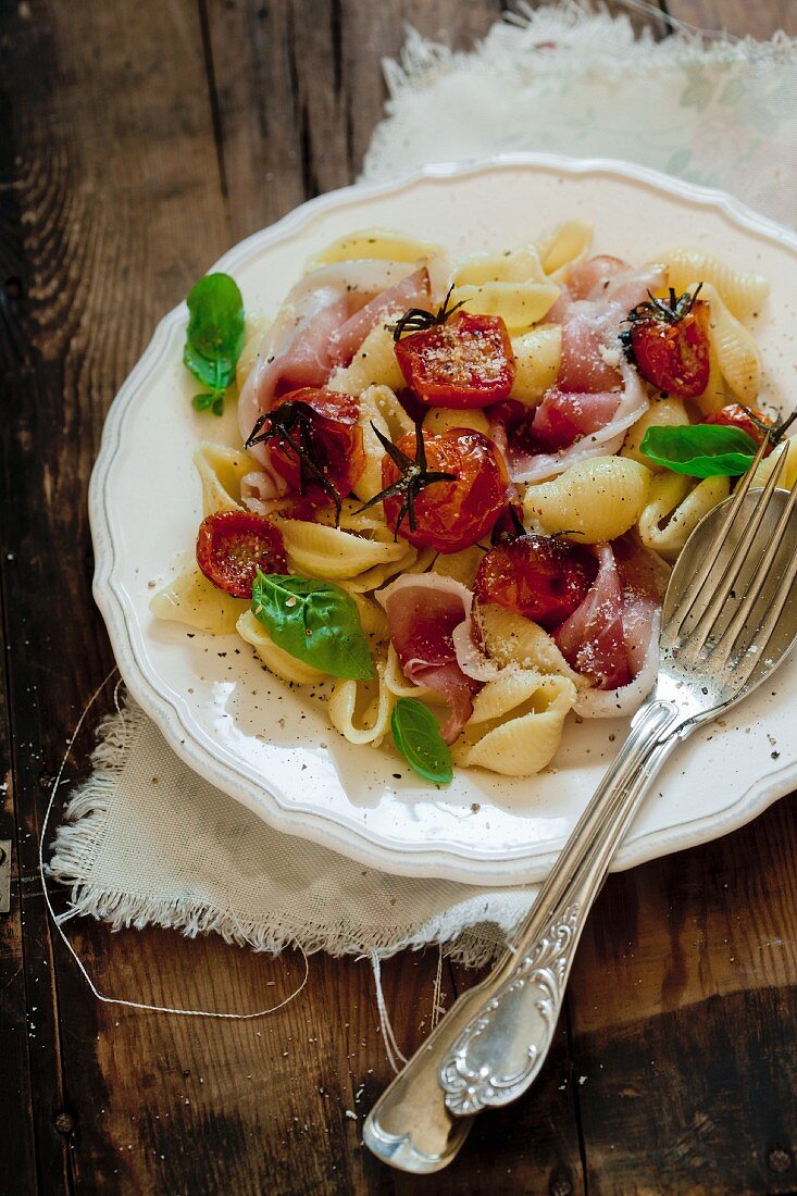 Conchiglie with roasted tomatoes and prosciutto