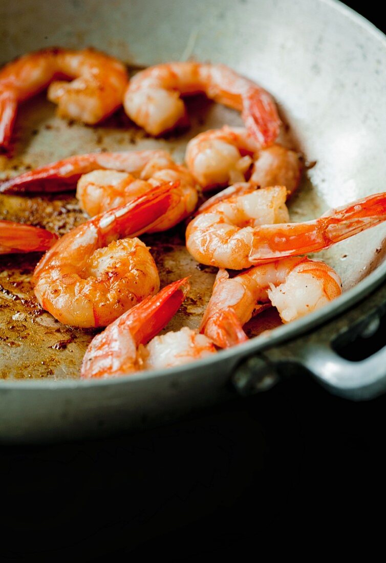 Shrimp being fried in a pan
