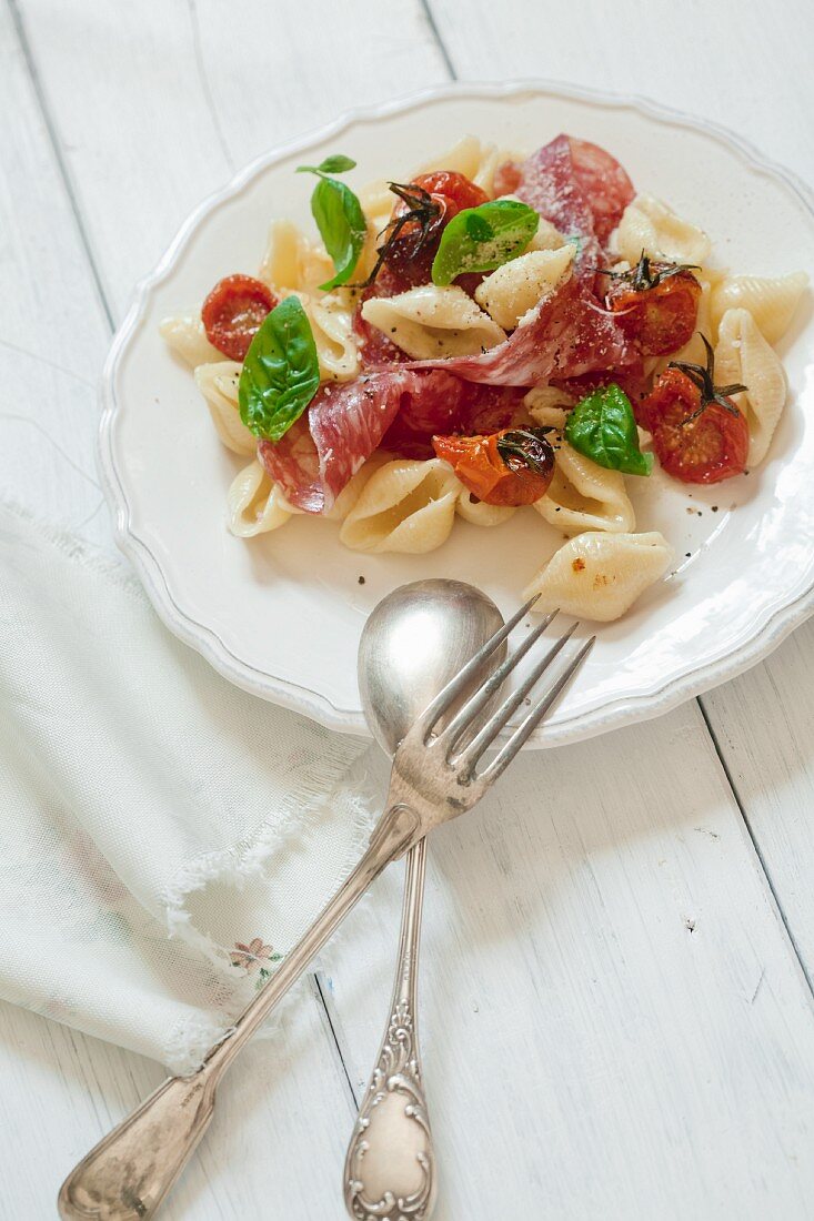 Conchiglie with roasted tomatoes and salami